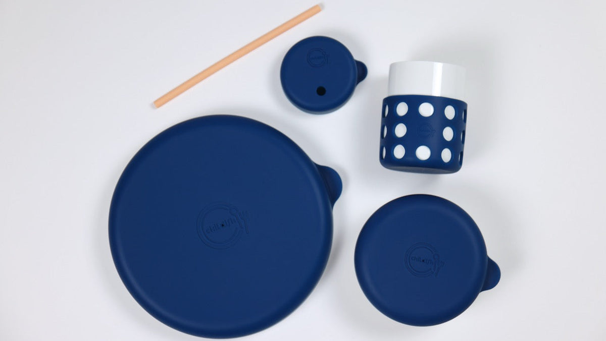 Set of blue silicone lids on a white background